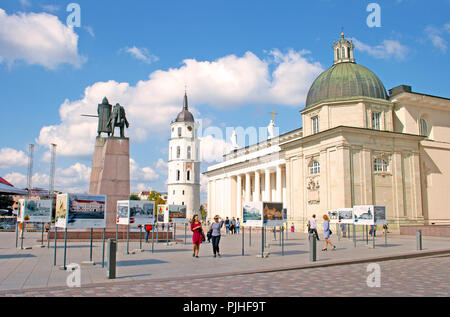 The Cathedral Square, main square of the Vilnius Old Town, with tower, Gediminas statue and people enjoying the city and the sun, Lihuania Stock Photo