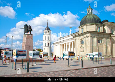 The Cathedral Square, main square of the Vilnius Old Town, with tower, Gediminas statue and people enjoying the city and the sun, Lihuania Stock Photo