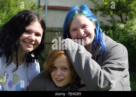 Portrait of Three Sisters in garden Surrey England Stock Photo