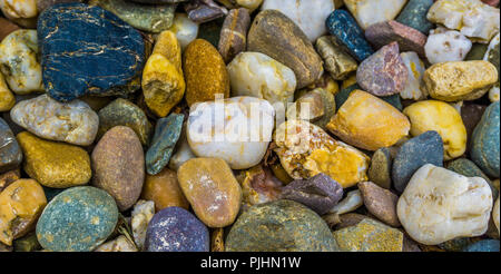 different colored pebble stones macro close up background texture Stock Photo