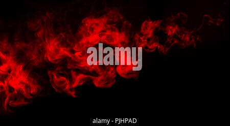 abstract shapes of mixed colors of blue and red smoke at dark background Stock Photo