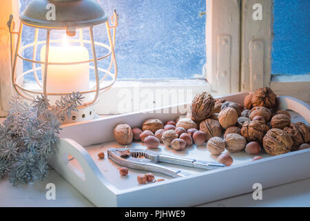 Tasty hazelnuts and walnuts and nutcrackers for Christmas Stock Photo