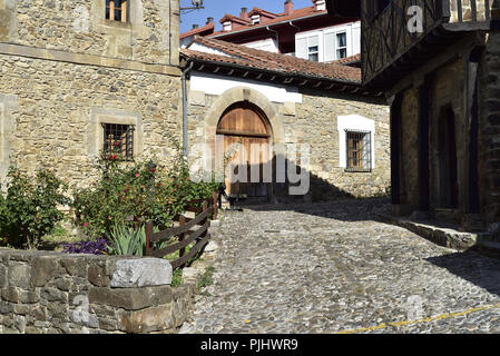 An enclosed residential street in Potes, Picos de Europa, Cantabria, northern Spain. Stock Photo