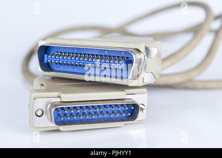 Old PC cables on a white table .. Com and lpt connectors for old computer stations. White background. Stock Photo