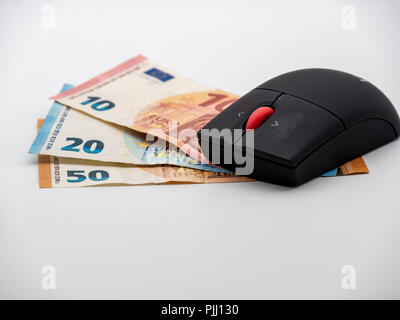 Top down view on Computer mouse on Euro money bills Stock Photo
