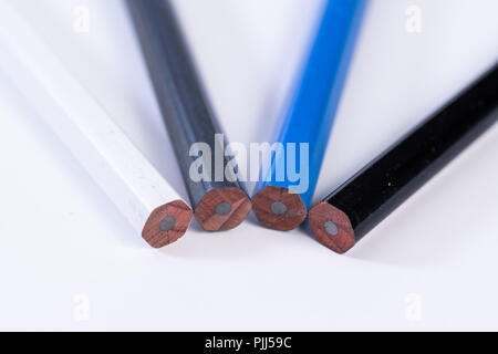 Several unsharpened new graphite pencils of different colors and patterns Stock Photo