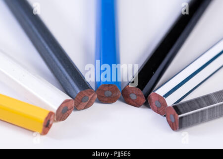 Several unsharpened new graphite pencils of different colors and patterns Stock Photo