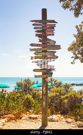 Directional signpost on the southernmost point of USA- Key West, Fort Zachary Taylor Historic State Park tropical sandy beach on daylight Stock Photo