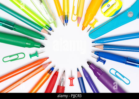 Stationery rainbow - circular arrangement of pens and pencils isolated on white background Stock Photo
