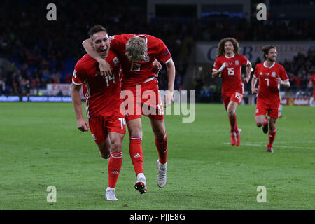 Cardifff, UK. 6th September 2018. Connor Roberts of Wales (14) celebrates with teammate David Brook (13) after he scores the 4th Wales goal. UEFA Nations League match, Wales v Republic of Ireland at the Cardiff city Stadium in Cardiff , South Wales on Thursday 6th September 2018. picture by Andrew Orchard/Alamy Live News Stock Photo