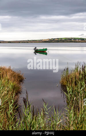 Ardara, County Donegal, Ireland weather. 7th September 2018. A boat lies in still waters before the storm conditions predicted for later this weekend. Overcast and sultry on the north-west coast this afternoon. Credit: Richard Wayman/Ģ����ý Live News Stock Photo
