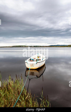 Ardara, County Donegal, Ireland weather. 7th September 2018. A boat lies in still waters before the storm conditions predicted for later this weekend. Overcast and sultry on the north-west coast this afternoon. Credit: Richard Wayman/Ģ����ý Live News Stock Photo