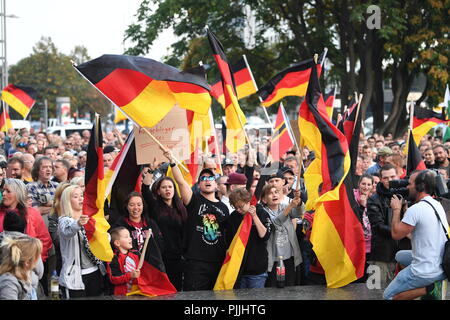 Chemnitz, Germany. 07th Sep, 2018. Demonstration of the right-wing populist alliance Pro Chemnitz: Participants waving Germany flags during the demonstration. Credit: Hendrik Schmidt/dpa/Alamy Live News Stock Photo