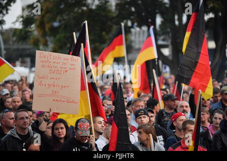 Chemnitz, Germany. 07th Sep, 2018. Demonstration of the right-wing populist alliance Pro Chemnitz: Participants stand with Germany flags at the demonstration. Credit: Hendrik Schmidt/dpa/Alamy Live News Stock Photo