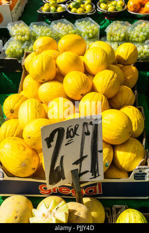Melons for sale on a fruit stall in Bromley High Street. Stock Photo