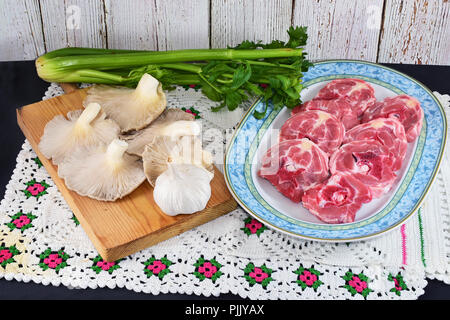 sliced raw lamb neck and mushrooms Stock Photo