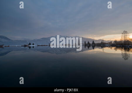 Evening mood at lake Eichsee in winter with view against Herzogstand, near Kochel, Bavarian Alps, Upper Bavaria, Bavaria, Germany Stock Photo