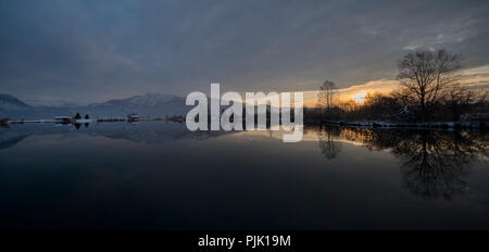 Evening mood at lake Eichsee in winter with view against Herzogstand, near Kochel, Bavarian Alps, Upper Bavaria, Bavaria, Germany Stock Photo