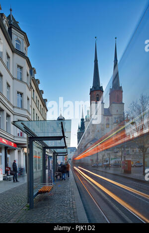 Germany, Saxony-Anhalt, Halle (Saale), Hallmarkt, market church and Red Tower, dusk, light trails of the tram Stock Photo