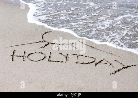 Lettering 'Holiday' on the beach Stock Photo