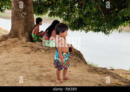 Chagres National Park, Panama - April 22, 2018: Small children playing under the trees along the Rio Chagres river Stock Photo