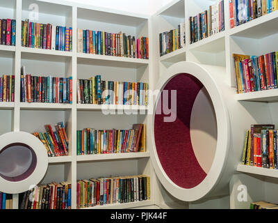 Corner of children's section with paperback books on shelves, Central Library, George IV Bridge, Edinburgh, Scotland, UK Stock Photo