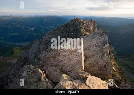 Climber at the summit of the Ahornspitze, Zillertal Alps, Tirol, Austria. Stock Photo