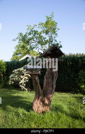 Idyllic garden with bird house, Hochsauerland, Sauerland, North Rhine-Westphalia, Germany Stock Photo