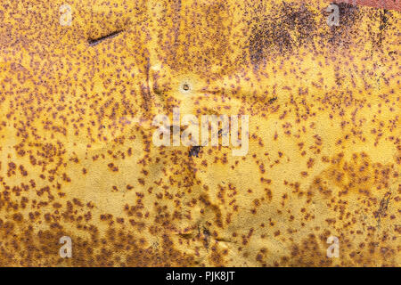 old rough rusted orange colored metal plate. rusty iron surface background Stock Photo