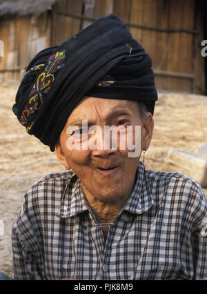 An elderly Hmong woman chuckles as her portrait is taken. Stock Photo