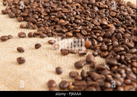 Background with coffee beans on the background of sacking Stock Photo
