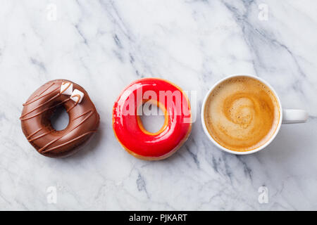 Coffee with donuts on marble table background. Copy space. Top view Stock Photo