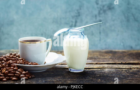 Cup of coffee, coffee beans and milk Stock Photo