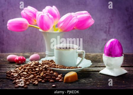 Easter breakfast, fresh coffee, easter eggs and tulips Stock Photo