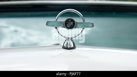 Details of american 50s cars during an exhibition in Medellín Colombia front logo with the windshield on the background Stock Photo