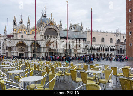 Venice, St Mark's Square and St Mark's Basilica, cafe, vacant tables and chairs Stock Photo