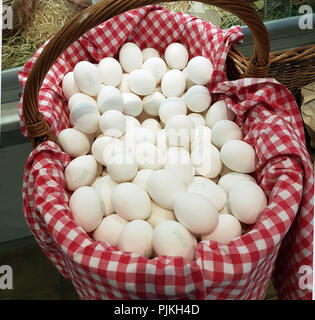 Free-range eggs in basket Stock Photo
