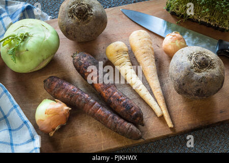 various winter vegetables on cutting board Stock Photo