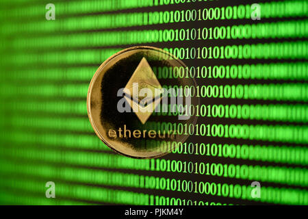 Symbolic image of digital currency, golden coin Ethereum Stock Photo