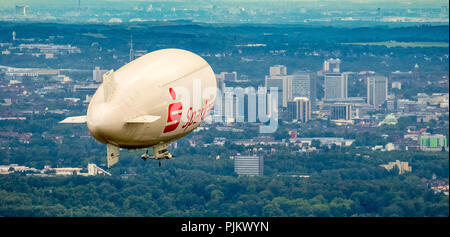 Zeppelin in front of the Essen skyline with town hall tower, Essen skyscrapers, Blimp WDL, airship company, Theodor Wüllenkämper, Sparkasse advertising, advertising inscription, Essen, Ruhr area, North Rhine-Westphalia, Germany Stock Photo