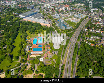 Bathers, sunbathing, swimming pool, sunbathing areas, bath towels, bathers, swimmers, pool area, Grugabad Essen, outdoor swimming pool on the hottest day in spring 2015, Essen, Ruhr area, North Rhine-Westphalia, Germany Stock Photo