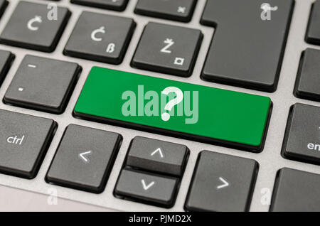 Green question mark key on computer keyboard. Stock Photo