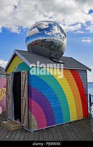 Taken to capture a reflection within the metal ball, which if enlarged reveals the photographer and the South End on Sea shoreline. Stock Photo