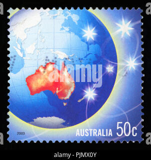 AUSTRALIA - CIRCA 2003: a stamp printed in Australia shows a globe with Australia highlighted, circa 2003 Stock Photo