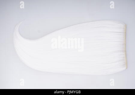 Blond white natural hair isolated on white background Stock Photo