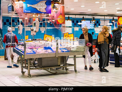 MADRID, SPAIN - 26 MARCH, 2018: Large food supermarket with customers and products and staff. Stock Photo