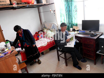 Yunnan Province, China. 8th Sept 2018. Wang Zhengxiang and his wife Pan Xiuhua are seen at the dormitory of Ayiyang Primary School in Sanmeng Village of Luquan Yi and Miao Autonomous County, southwest China's Yunnan Province, Sept. 5, 2018. One teacher, eight students, none was and will be given up thanks to rural teacher Wang Zhengxiang. Yunnan Province, China. 8th Sept 2018. Credit: Xinhua/Alamy Live News Stock Photo