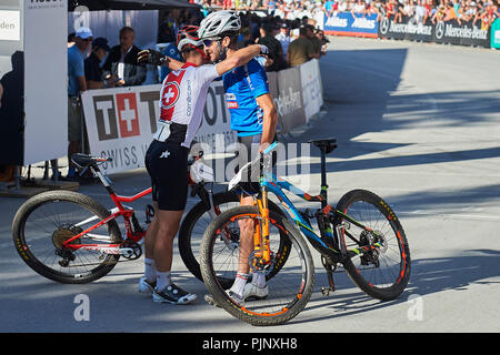 Lenzerheide Switzerland. 8th September 2018. Nino Schurter and Gerhard Kerschbaumer at the UCI 2018 Mountain Bike World Championships Men Elite Cross Country Olympic XCO in Lenzerheide. Credit Rolf Si...