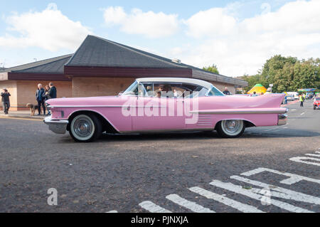 Glasgow, Scotland, UK. 8th September, 2018. Pink Cadillac on display at Giffnock Village Classic Car Show which returns for the event's fifth year. On show are a range of classic, vintage and unique cars as well as fun and entertainment for all the family. Credit: Skully/Alamy Live News