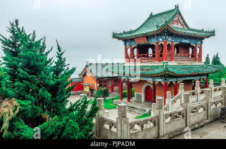 Buddhist Temple with colorful decorative details at the top of the Tianmen Mountain, Hunan Province, Zhangjiajie, China Stock Photo